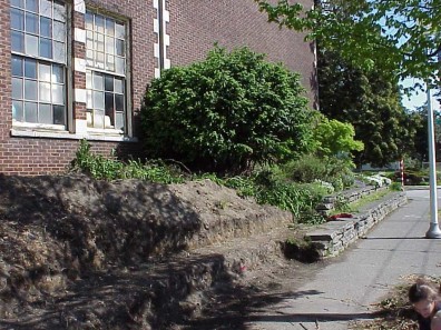 The excavated site prepared for retaining wall installation.