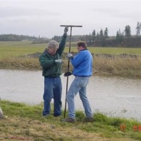 Installing piezometers.