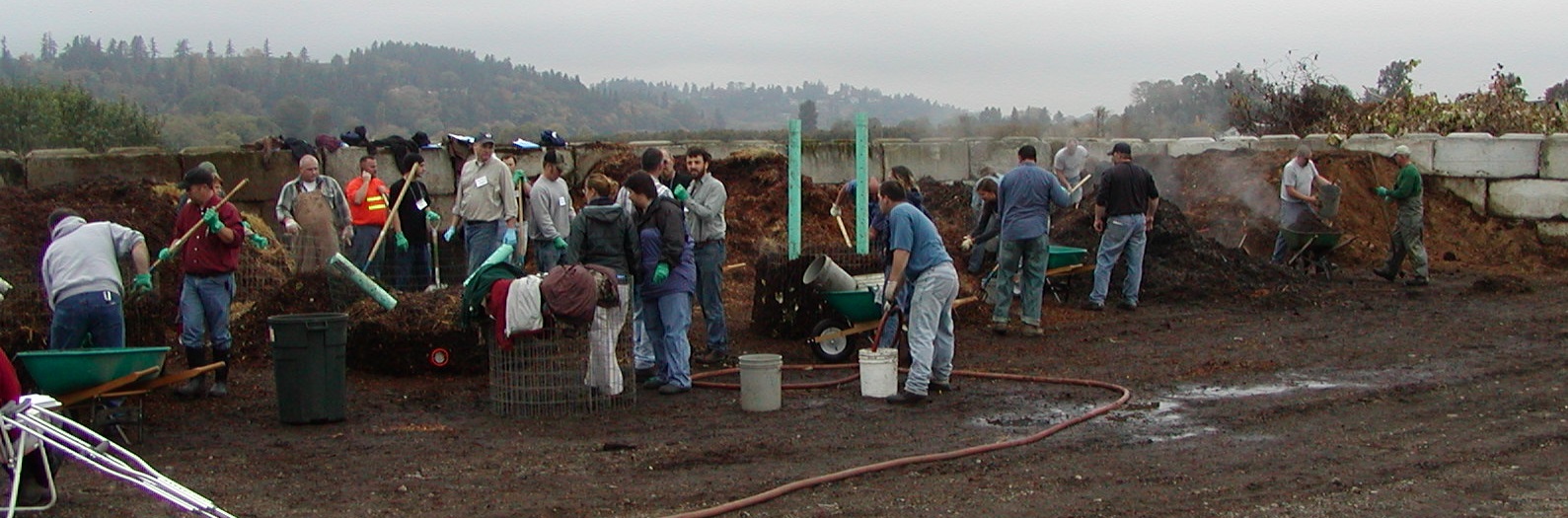 Group of people, long compost pile