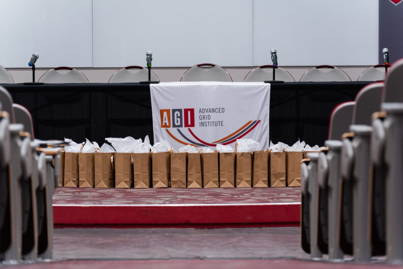 AGI Day stage with goodie bags