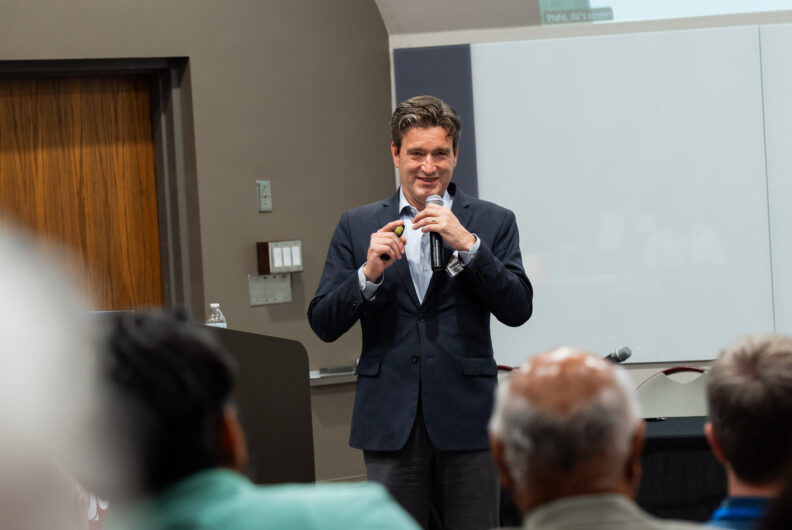 Man speaking into a microphone