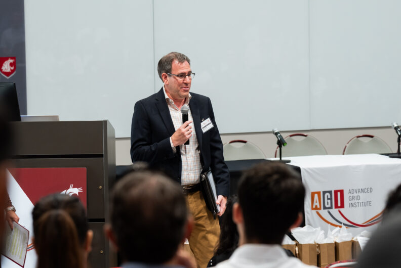 Man speaking into a microphone
