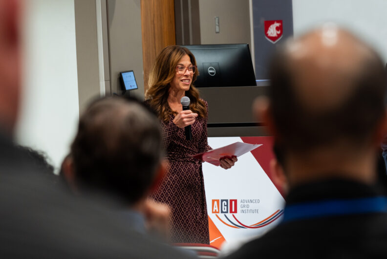 Woman speaking into a microphone