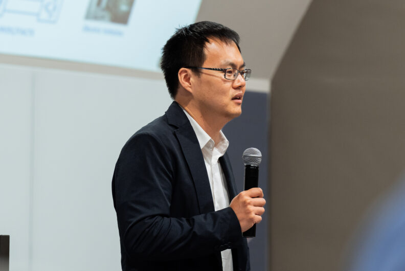 Man speaking into a microphone