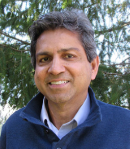 A headshot of Aziz Makhani