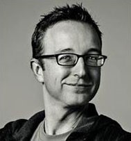 A black and whit headshot of Scott Maloney