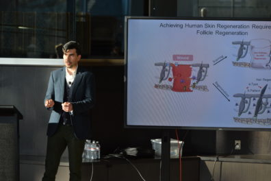 A photo of a faculty member giving a presentation