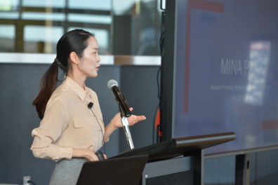 A photo of a faculty member giving a presentation