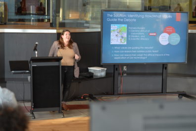 A photo of a faculty member giving a presentation