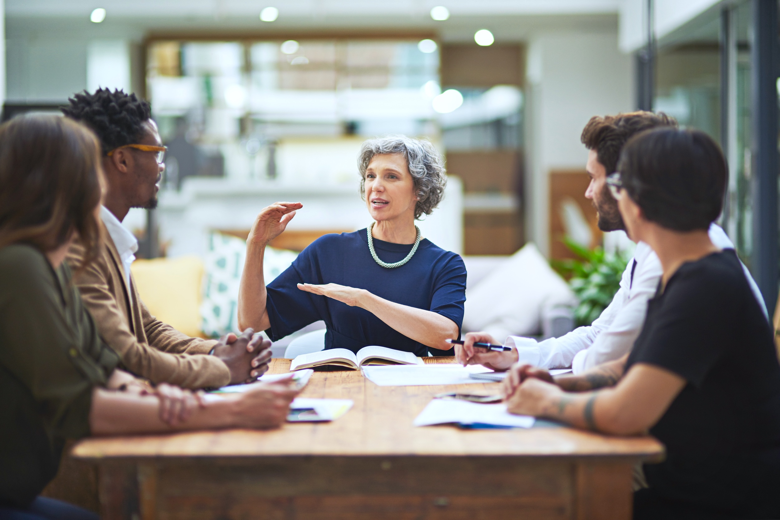 Businesswoman meeting with research team.