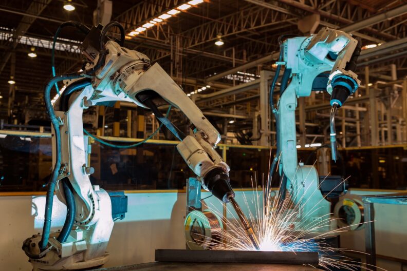 Industrial robots working together.