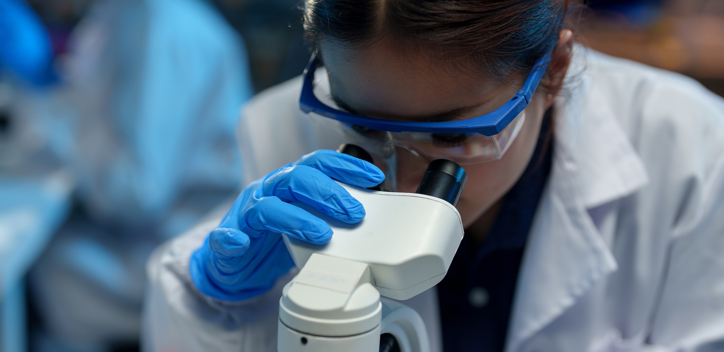 Scientist with microscope