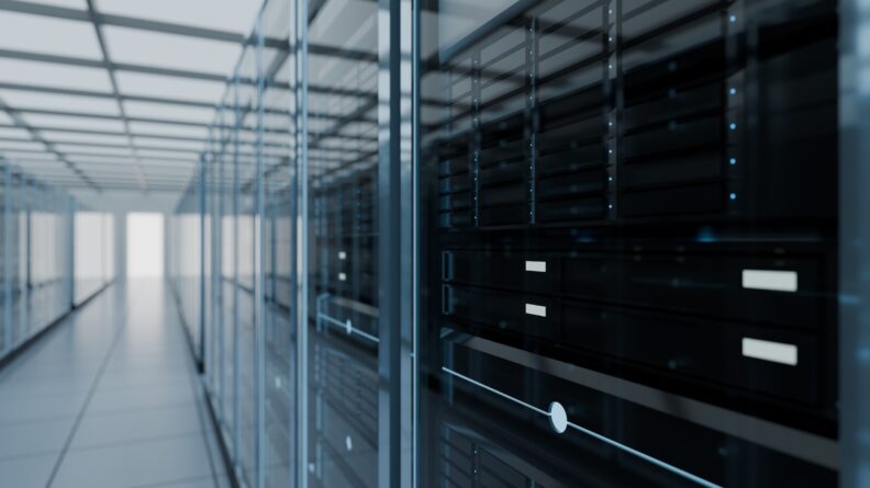 Image of racks of equipment in a modern data center