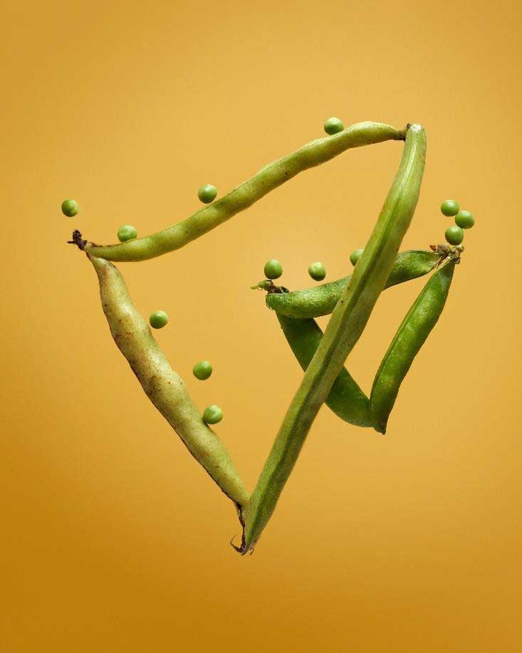 Green beans with peas forming two triangles.