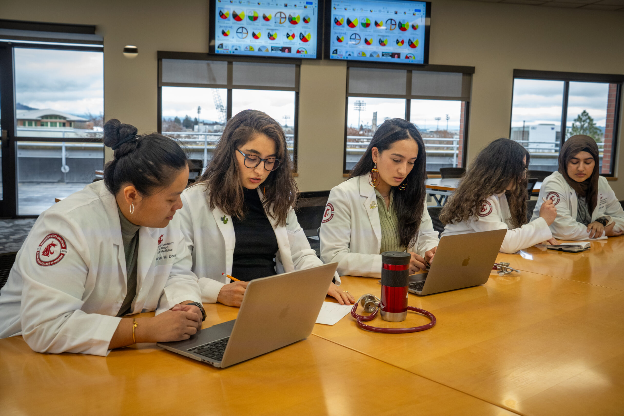 Students working on projects in the community room