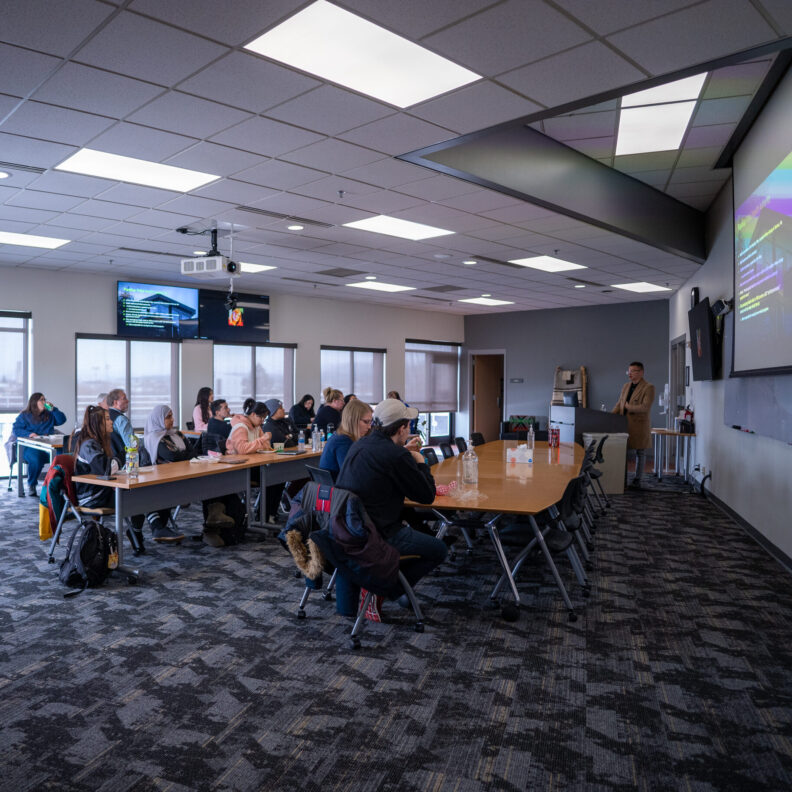 Participants listening to speaker in tribal community room