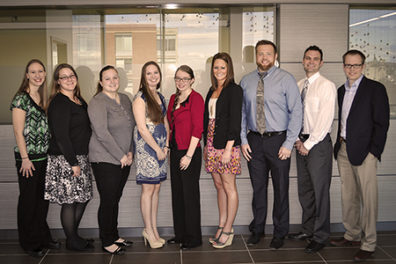 nine doctorate students at the luncheon