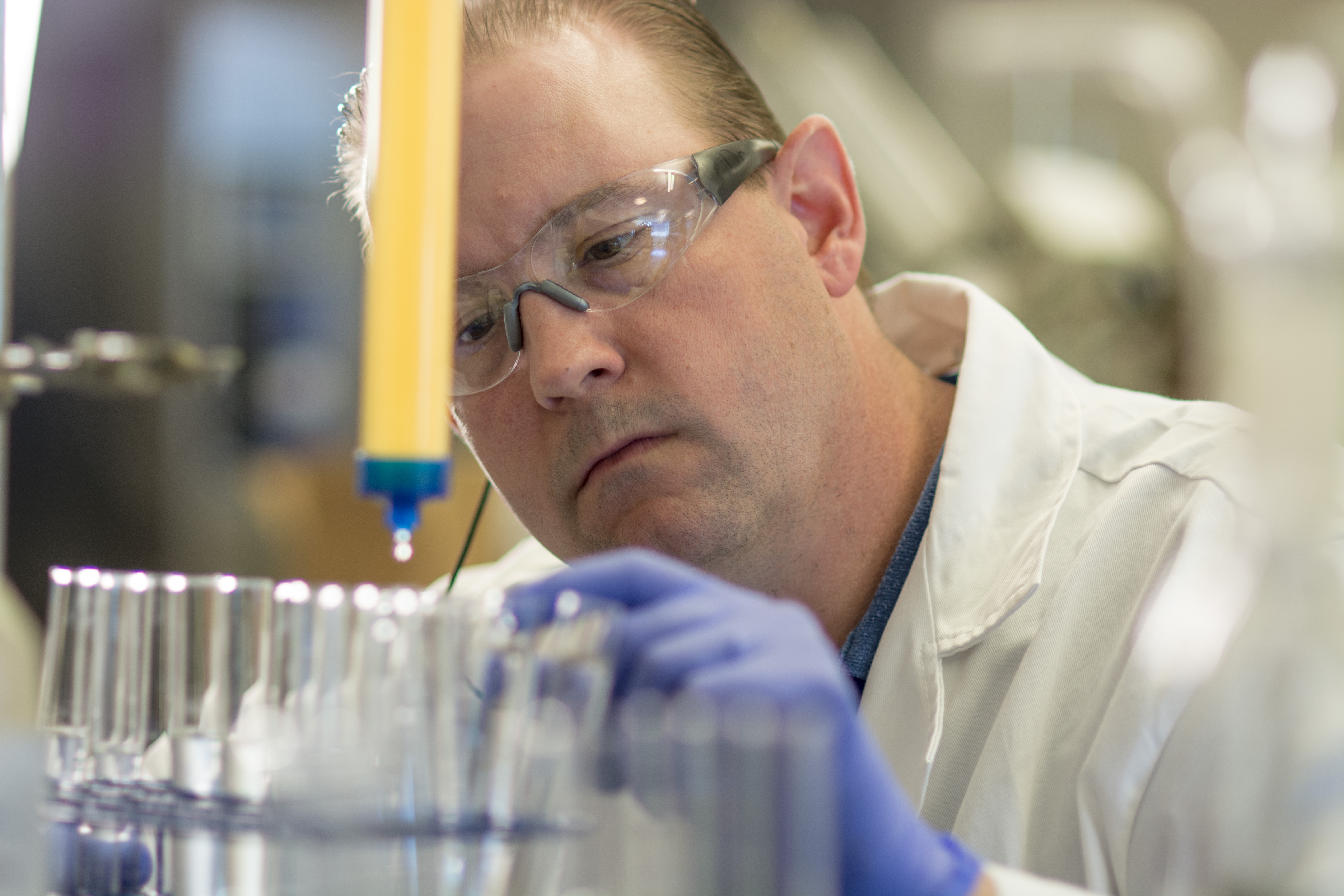 Professor Travis Denton working in his lab.