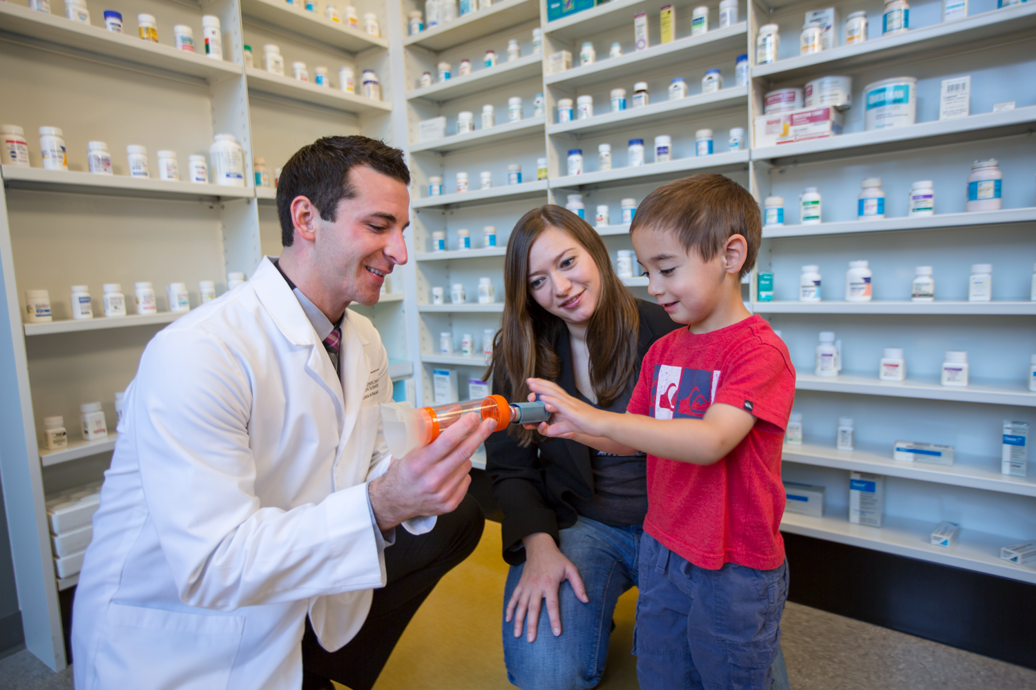 Pharmacist with pediatric patient