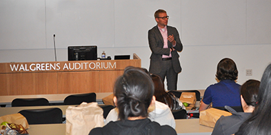Adams speaking to students