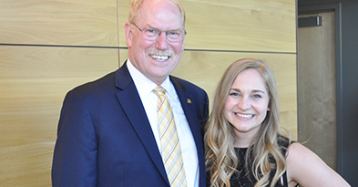 Tom Menighan networking with student pharmacist 