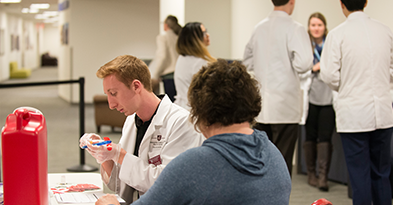 Student pharmacist preparing an immunization