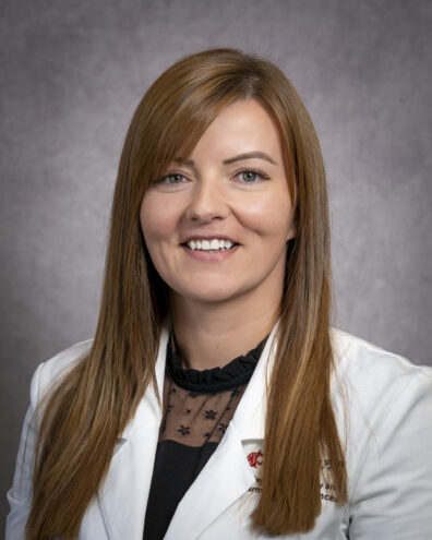 Ashley Aday in her white coat photo.