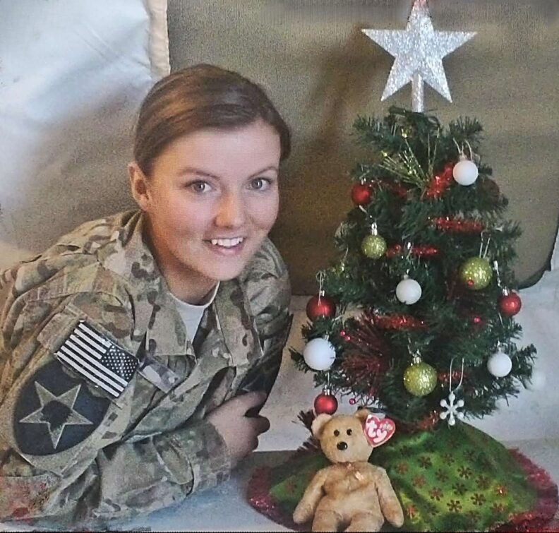 Ashley Aday pictured with a small Christmas tree during her deployment in Afghanistan.