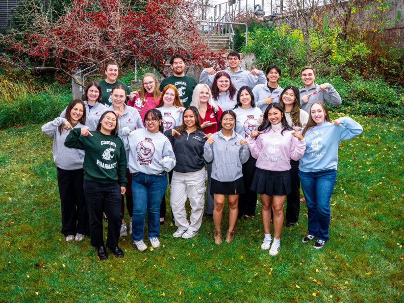 Pharmacy student ambassadors wearing WSU College of Pharmacy and Pharmaceutical Sciences swag