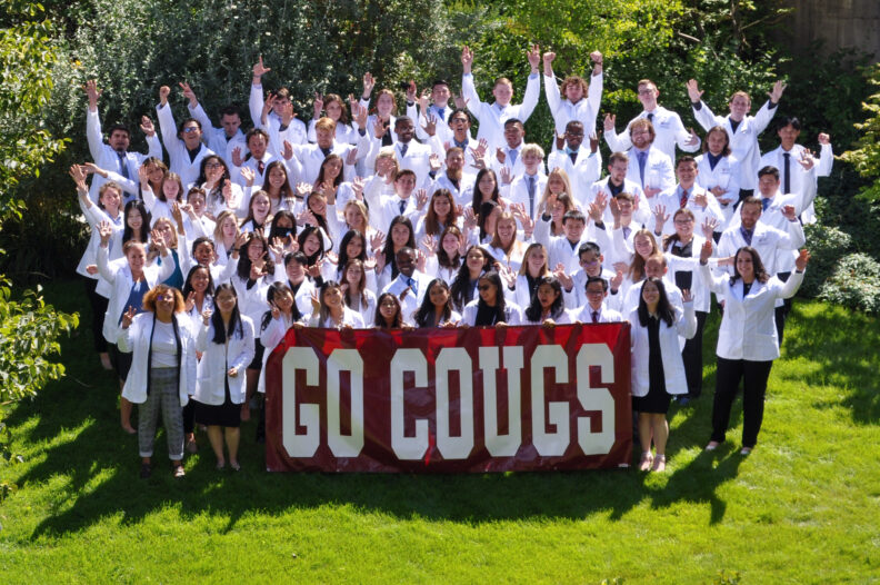 class of 2025 group white coat photo