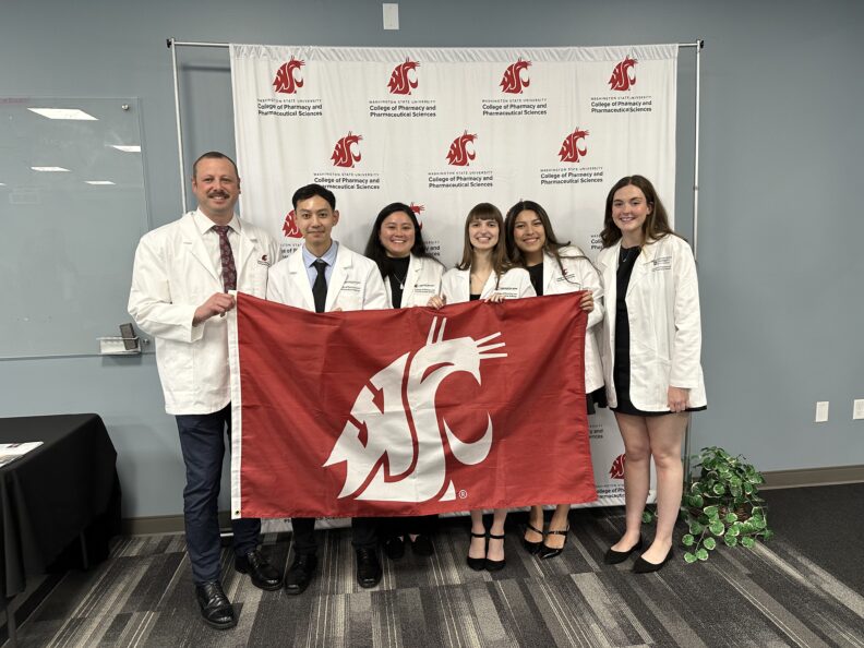 6 Yakima class of 2029 pharmacy students pose for a group photo during their orientation