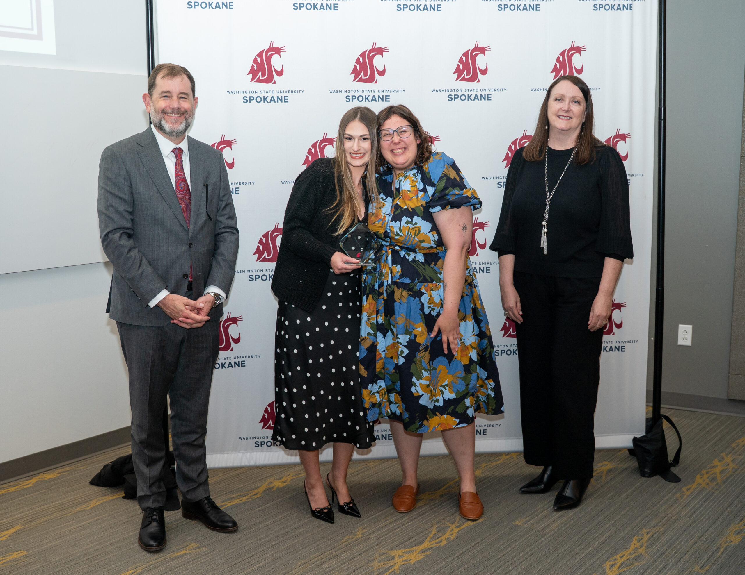 Seaonna Piper holding Health Sciences Student Leadership Award alongside Provost Chris Riley-Tillman, Academic and Student Success Advisor Hannah Green, and Interim Dean Julie Akers