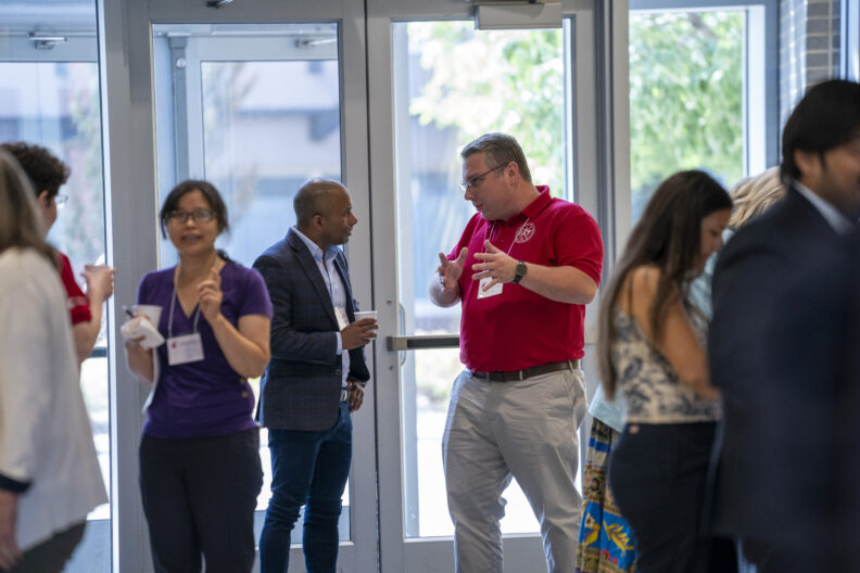 Guests interacting with each other at the Industry Advisory Board annual meeting.