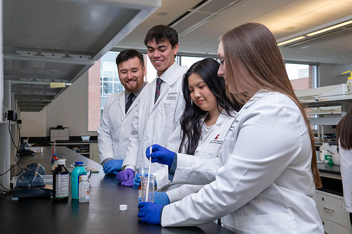 Pharmacy students practice compounding