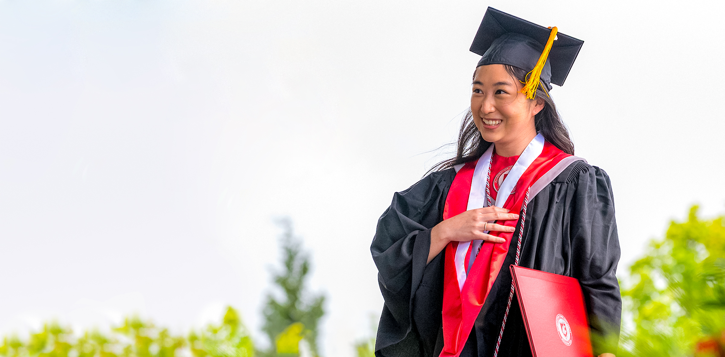 Nursing student receiving diploma during commencement ceremony