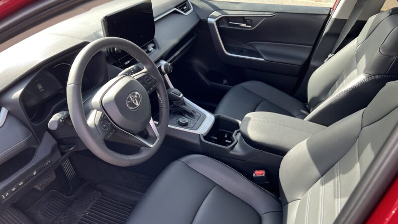 Interior view of driver's seat of the Red Rav4