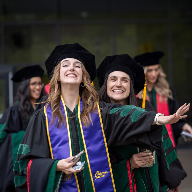 College of medicine students posing for camera during graduation