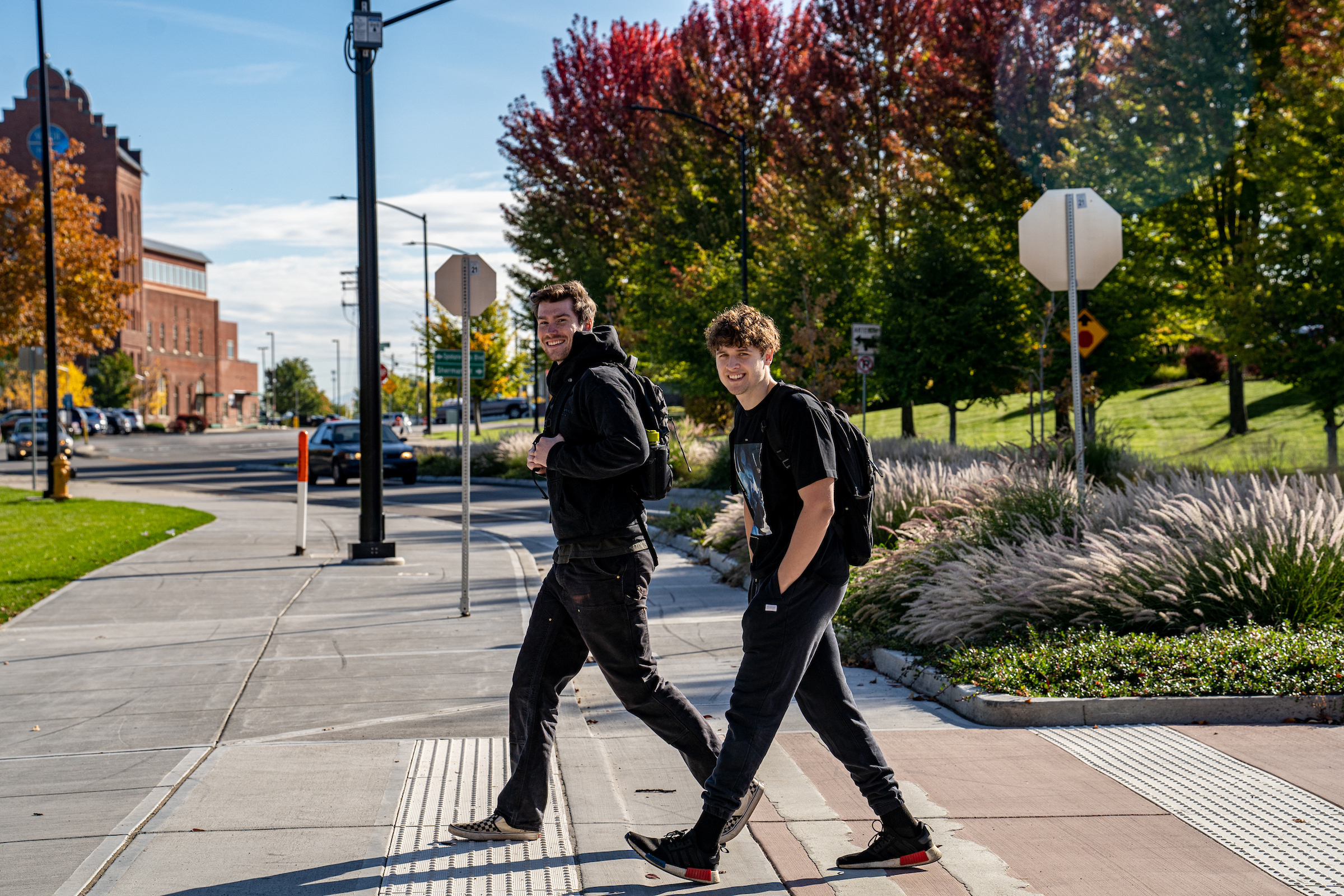 Students walking across crosswalk on their way to WSU Spokane campus