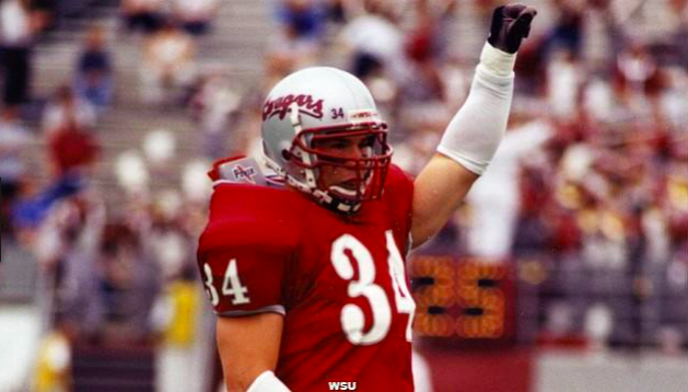 Steve Gleason wearing number 34 in his WSU Cougar Football uniform raising his fist