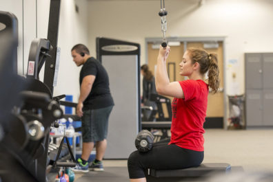 Student in fitness center