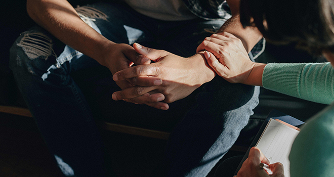 Person with hands folded