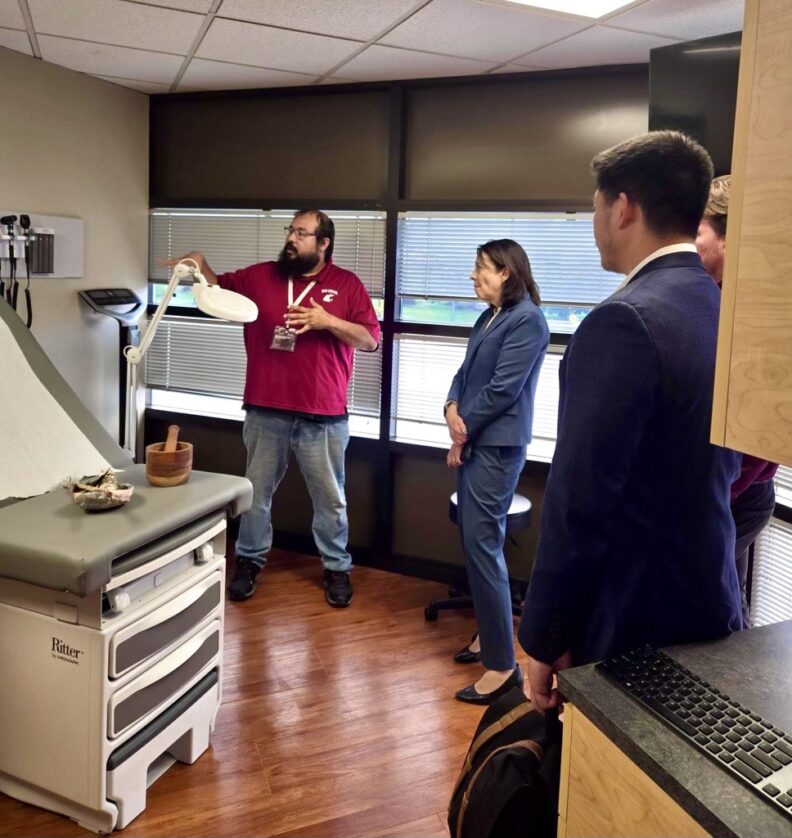 Jerry Crowshoe tours Sen. Cantwell through simulation space.