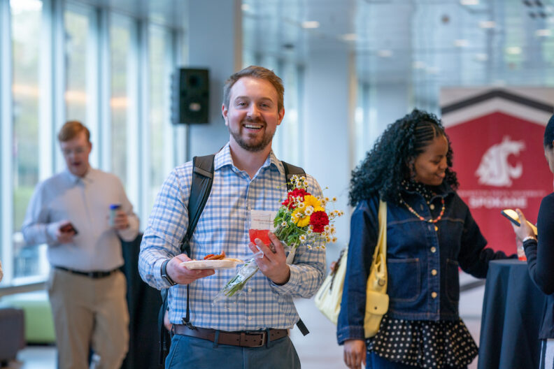 Matthew Hohenwalter with a bouquet of flowers. 