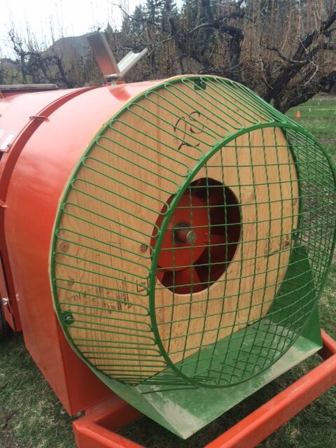 Plywood ‘donut’ applied to the rear of a sprayer to restrict air intake.