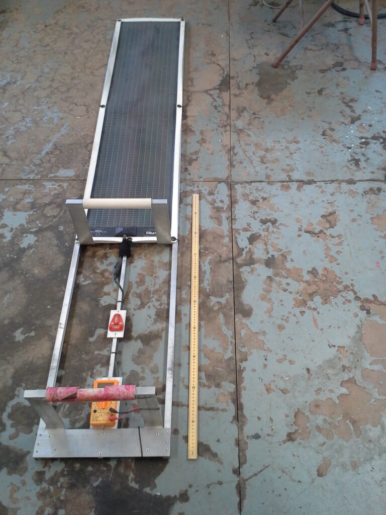 A long flat solar panel designed to go underneath a grapevine