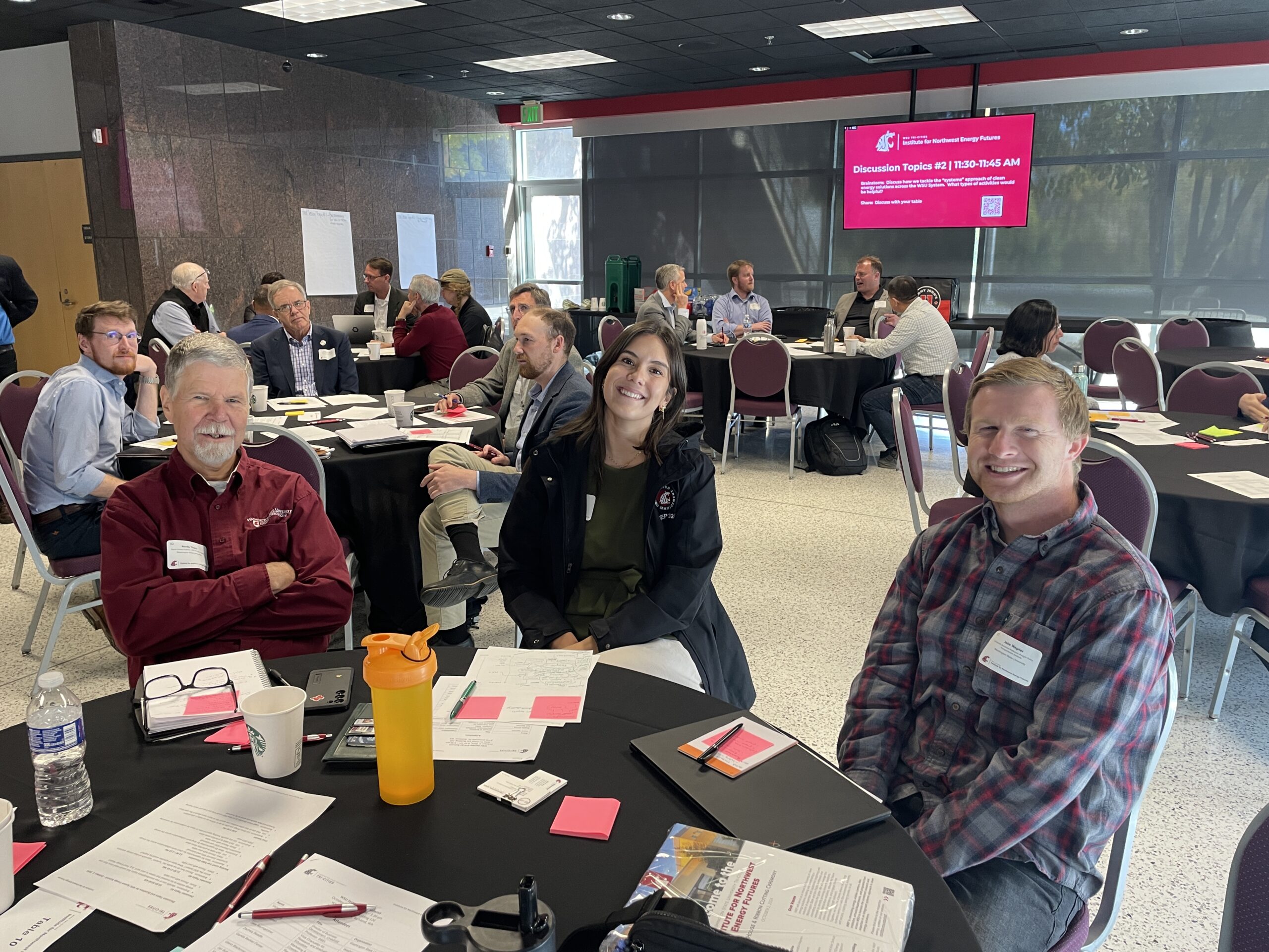 Bright smiles from Randy Thorn, Energy Engineer with the WSU Energy Program, Shelby Ruiz, Research Project Manager ID&CL, and Jake Wagner, CAHNRS Scholarly Assistant Professor at the 2024 Energy Summit.