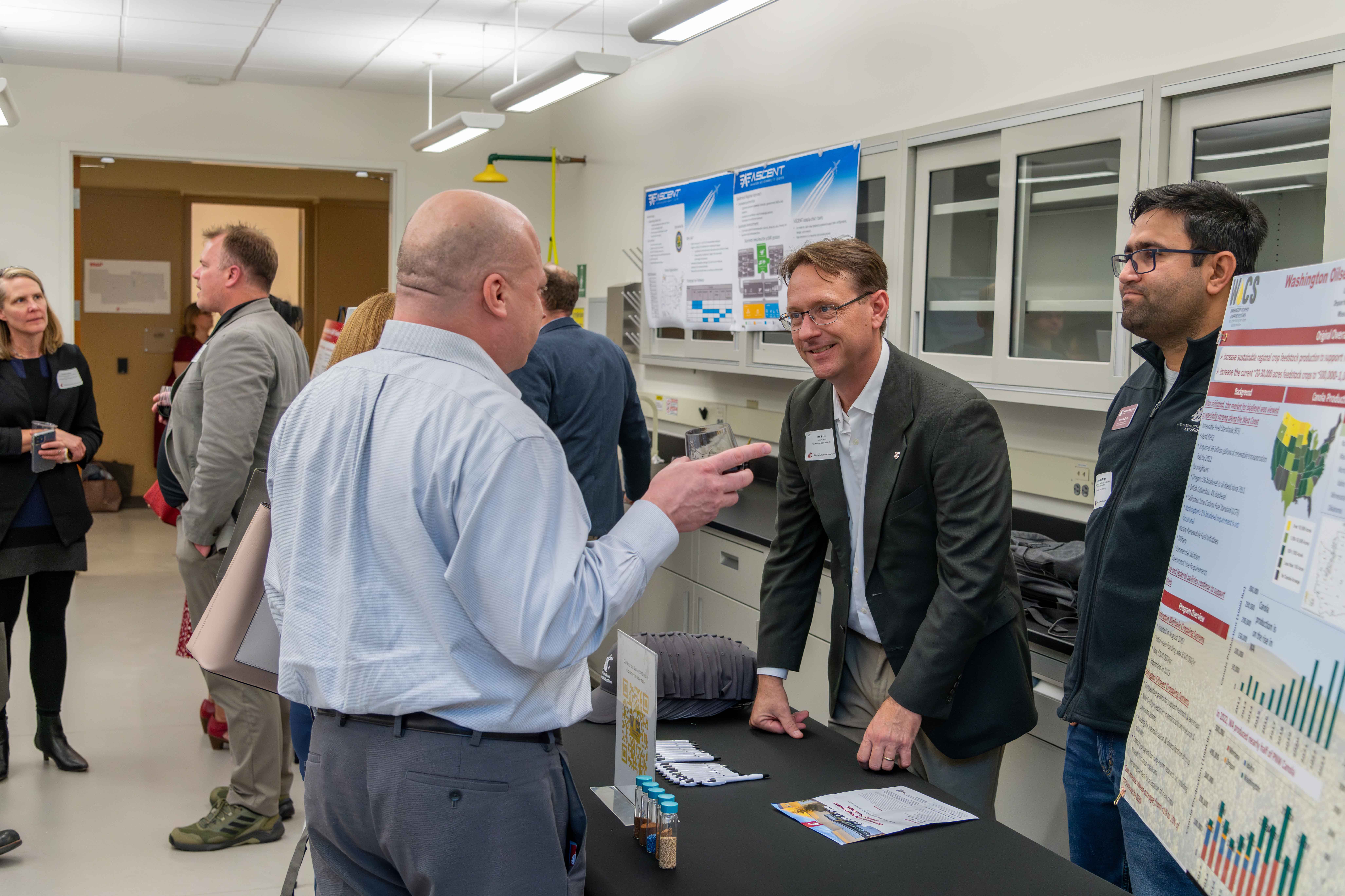 Man talking to another man representing WSU oilseed entity,