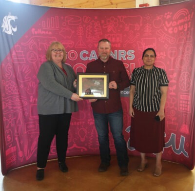 INEF Assistant Director Chad Kruger receiving the Faculty Administrator Award from the WSU College of Agricultural, Human, and Natural Resource Sciences.