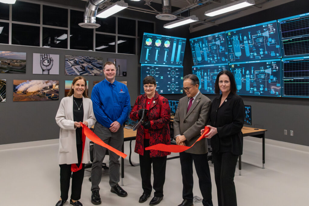 Delegation of WSU representatives cuts a ribbon inside the Energy Learning Center.