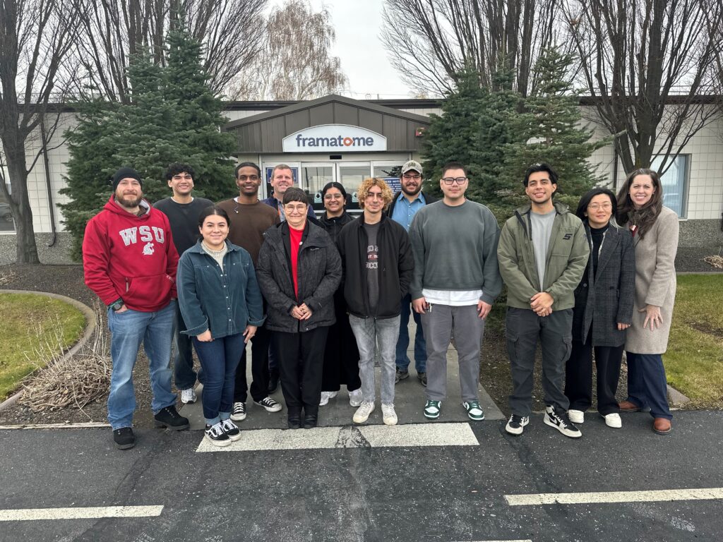 A group of people standing outside the Framatome building in Richland, Washington